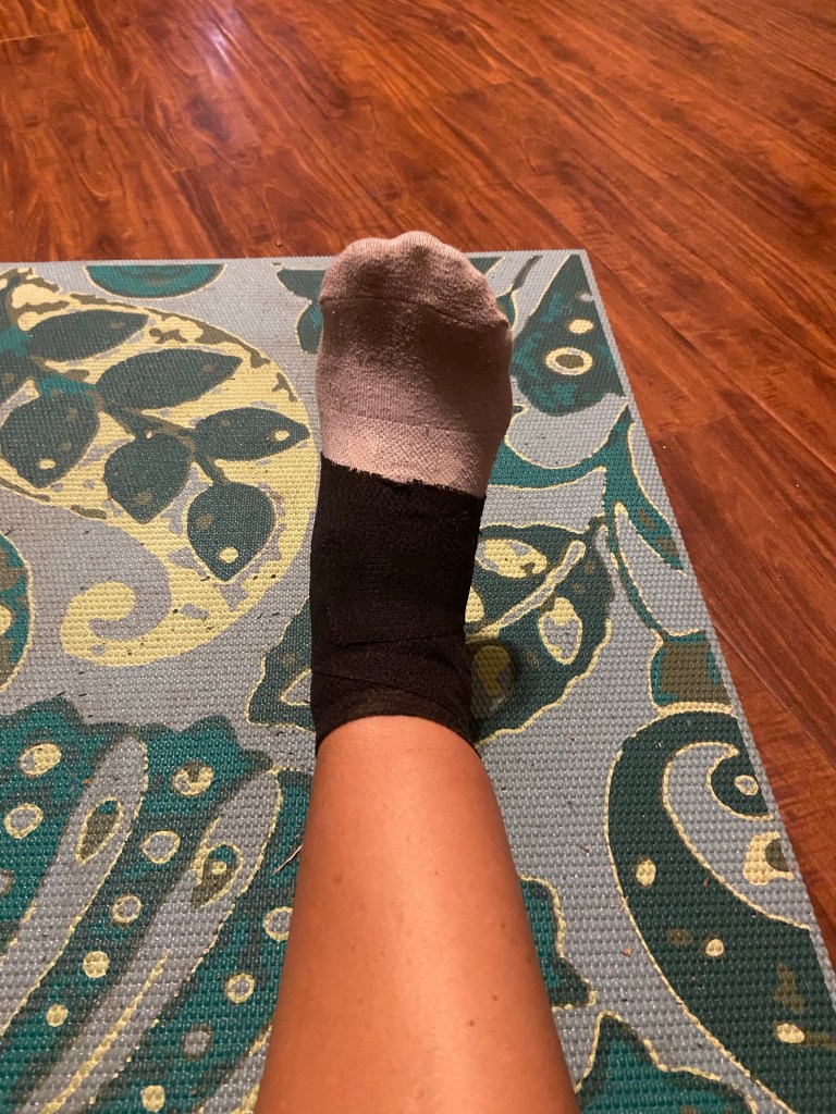 Ankle wrapped with support tape